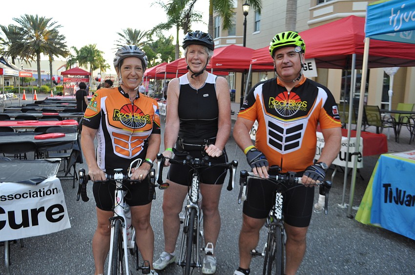 Erin Halstead, Leeann Scales and Chris Maki prepare for the 62-mile ride.