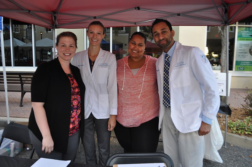 Lake Erie College of Osteopathic medicine students Amanda Kelley, Mandy Peebles, pharmacist Mitchelle Rodriguez and Sapan Haribhakti provide blood glucose and blood pressure testing on site.