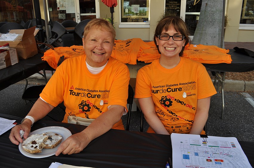Canada West and Samantha Nader check in volunteers.