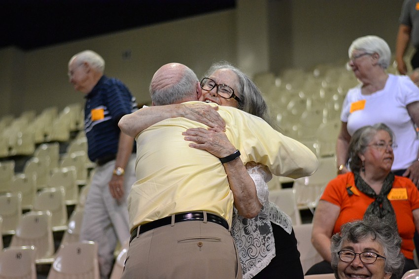 June Shanaberger spots long-lost friend Brian Chellas in the crowd.