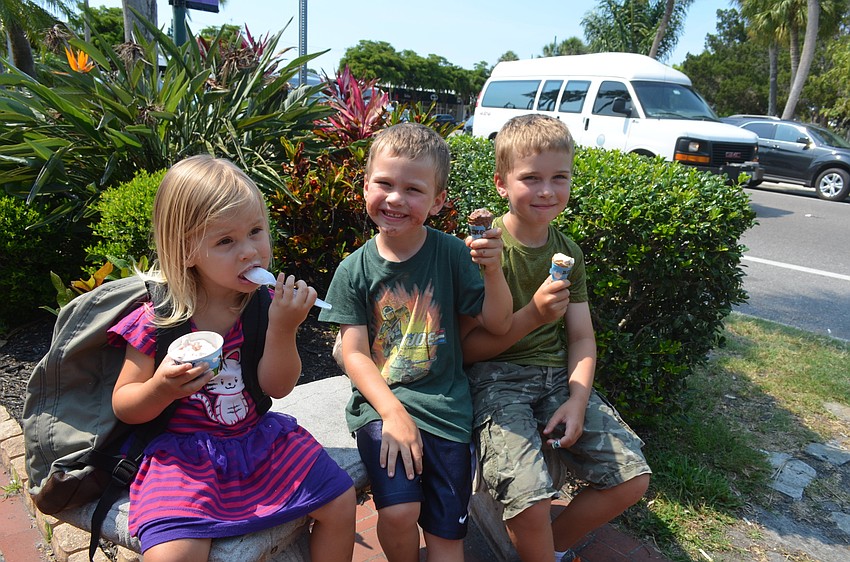 Cameron, 2, Wes, 5, and Grant, 7, Parton enjoy their ice cream. “I love it because I’m never gonna give it up,” Wes Parton, whose favorite flavor is chocolate fudge, said.