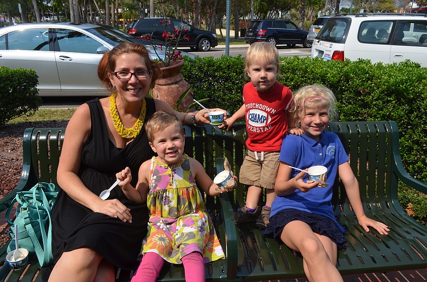Erin, Jasper, 3, Jet, 1, and Kalina, 7, Ernst eat their ice cream. “I like ice cream because sometimes there’s chocolate and nuts,” Jasper Ernst, who enjoyed Chunky Monkey, said. “It’s something good for hot days,” Kalina Ernst, whose flavor of choice is