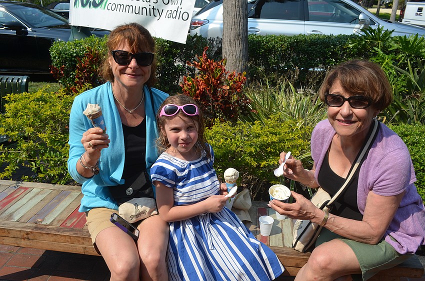 Roxanne, Aleena, 6, and Karla enjoy their snack. “It tastes sweet, and I like the raspberry,” Aleena said.