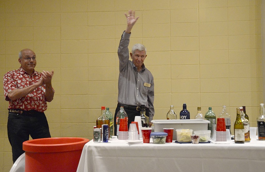 Larry Bennison, a board member, identifies himself to Siesta Isles members.