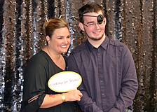 Rebecca Blitz and Jamie Myers pose in the photo booth at Cooking for Wishes.