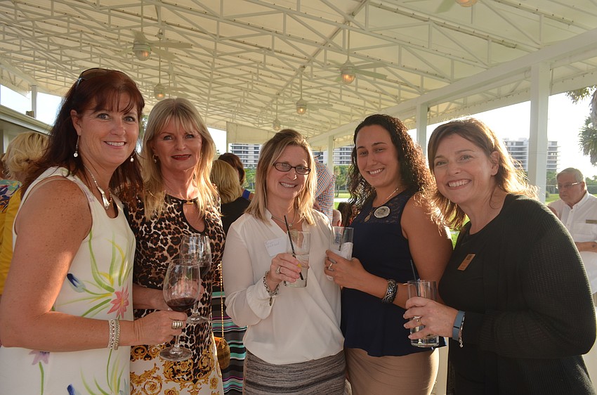 Tammy Halsted, of RVA, Ramona Glanz, of National Awards, Tonya Atchison, of Disabled Veterans Insurance Agency, Aurora Kane, of Century 21, and Assistant Town Manager Anne Ross