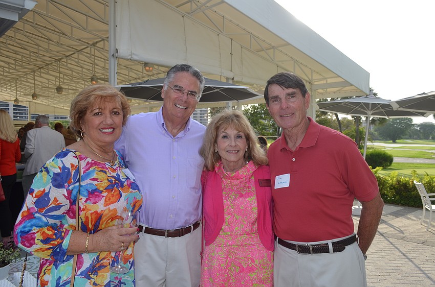 Chris Lynch, of Lynches Pub & Grub, Armando Linde, of the Longboat Key Kiwanis Club, and Commissioner Lynn and Jim Larson