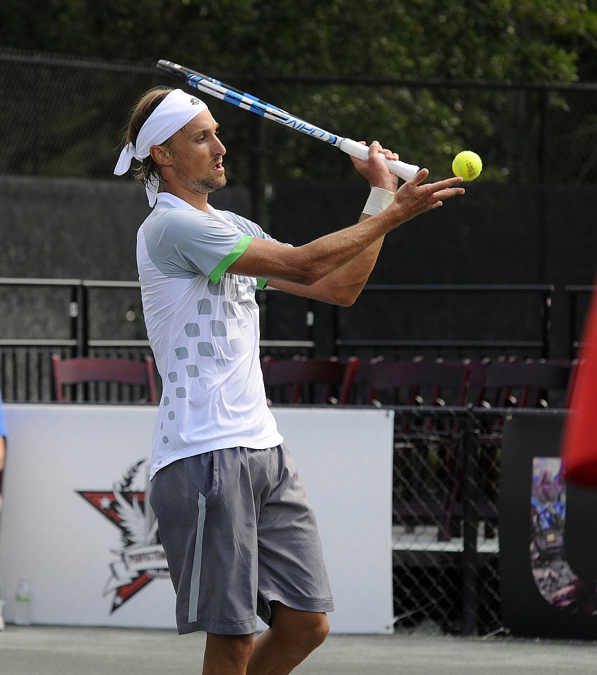 Ruben Bemelmans tosses the ball back to his opponent.