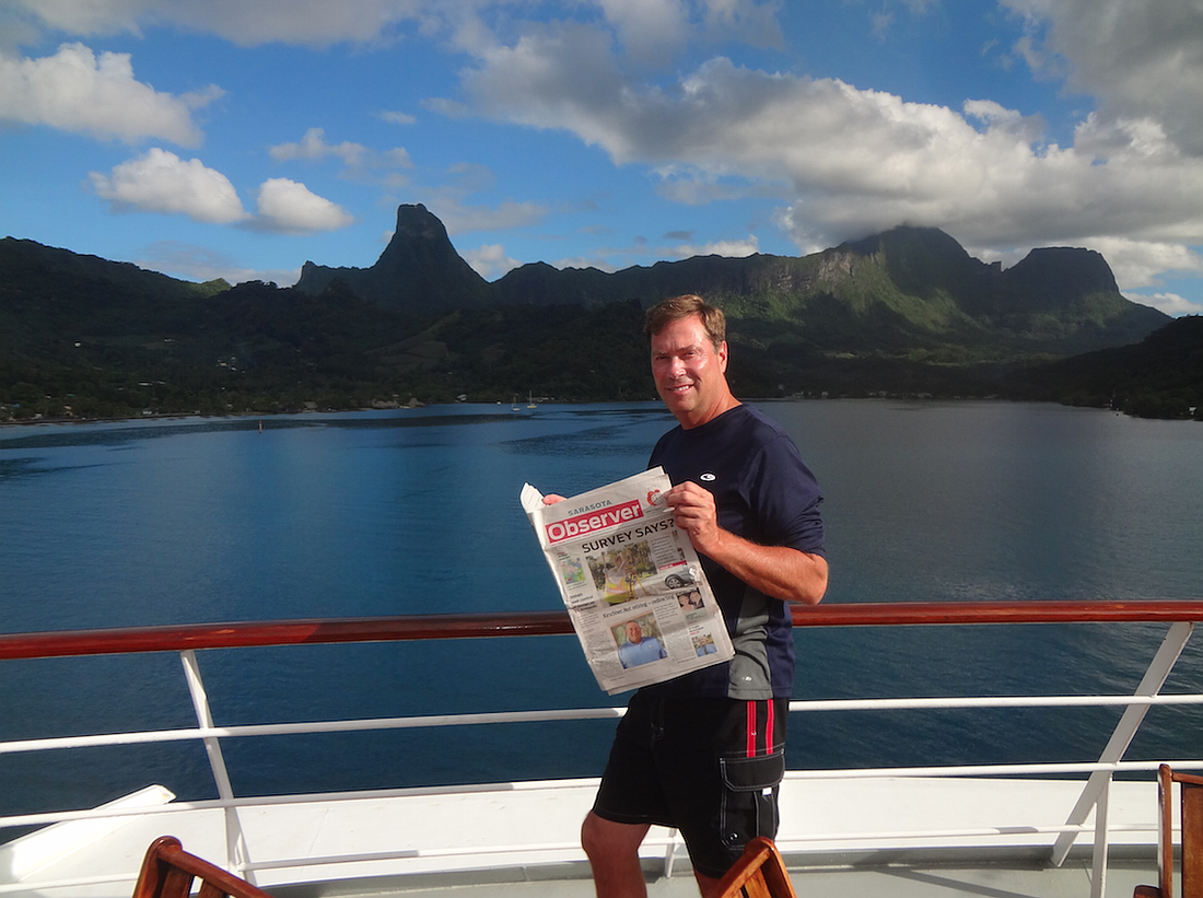 Gary Newcomer relaxes with his Observer overlooking Cooks Bay in Moorea, French Polynesia.