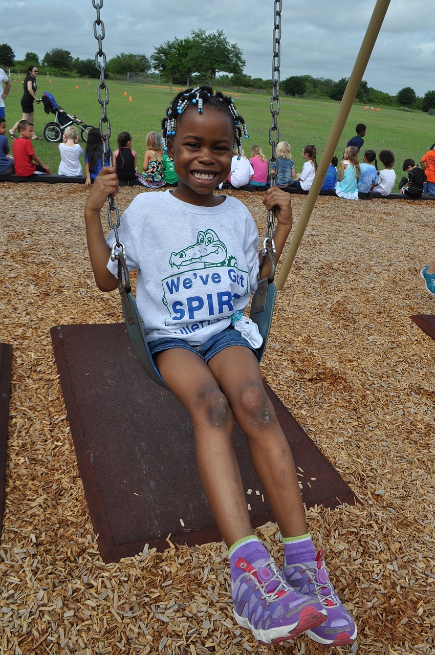 Ja’niah Carpenter, 6, heads to the playground when she’s done walking.