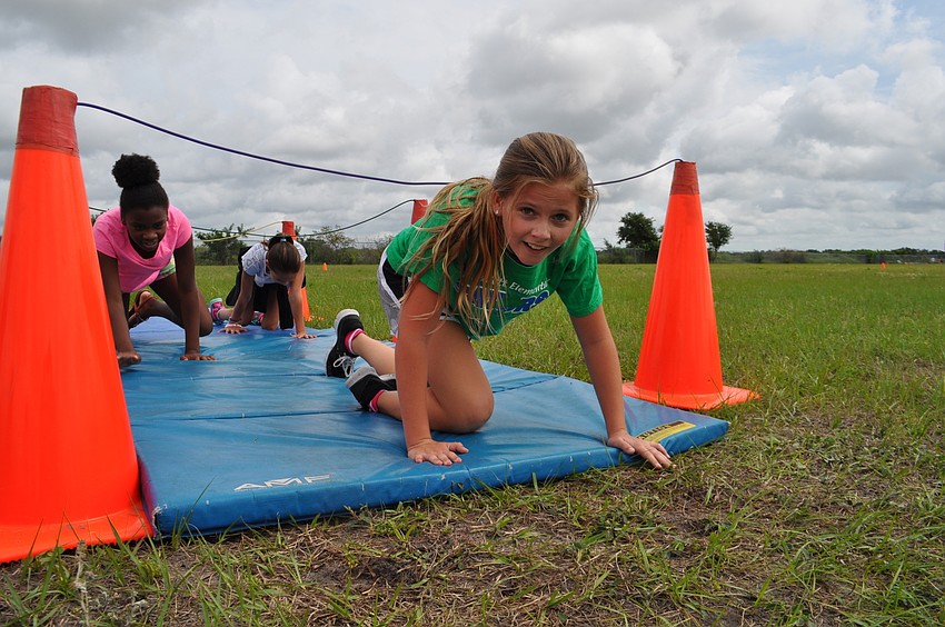 Madyson Hiser easily makes it under the rope.