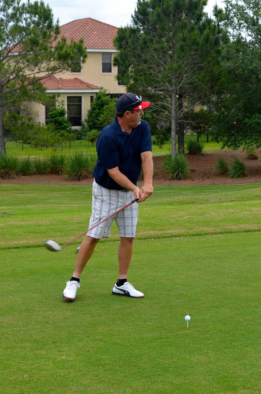 Jeff Corl focuses on his swing in hopes of reaching his target in just a few shots.