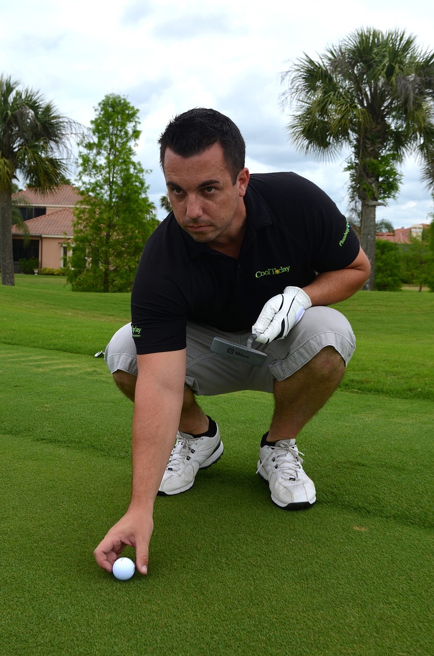 Colin Demers lines up his ball with the intended target before grabbing his club or putter.