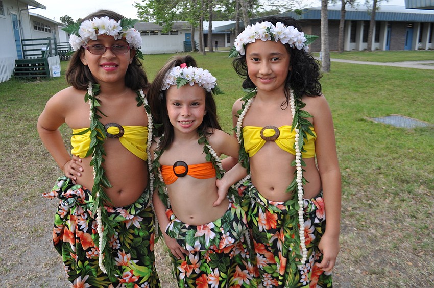 Tara Elementary’s Maryann Perez performed Polynesian dances with other girls from Beautiful Sei of Polynesia. She poses with Gianna Pola and Laite Fiefia.