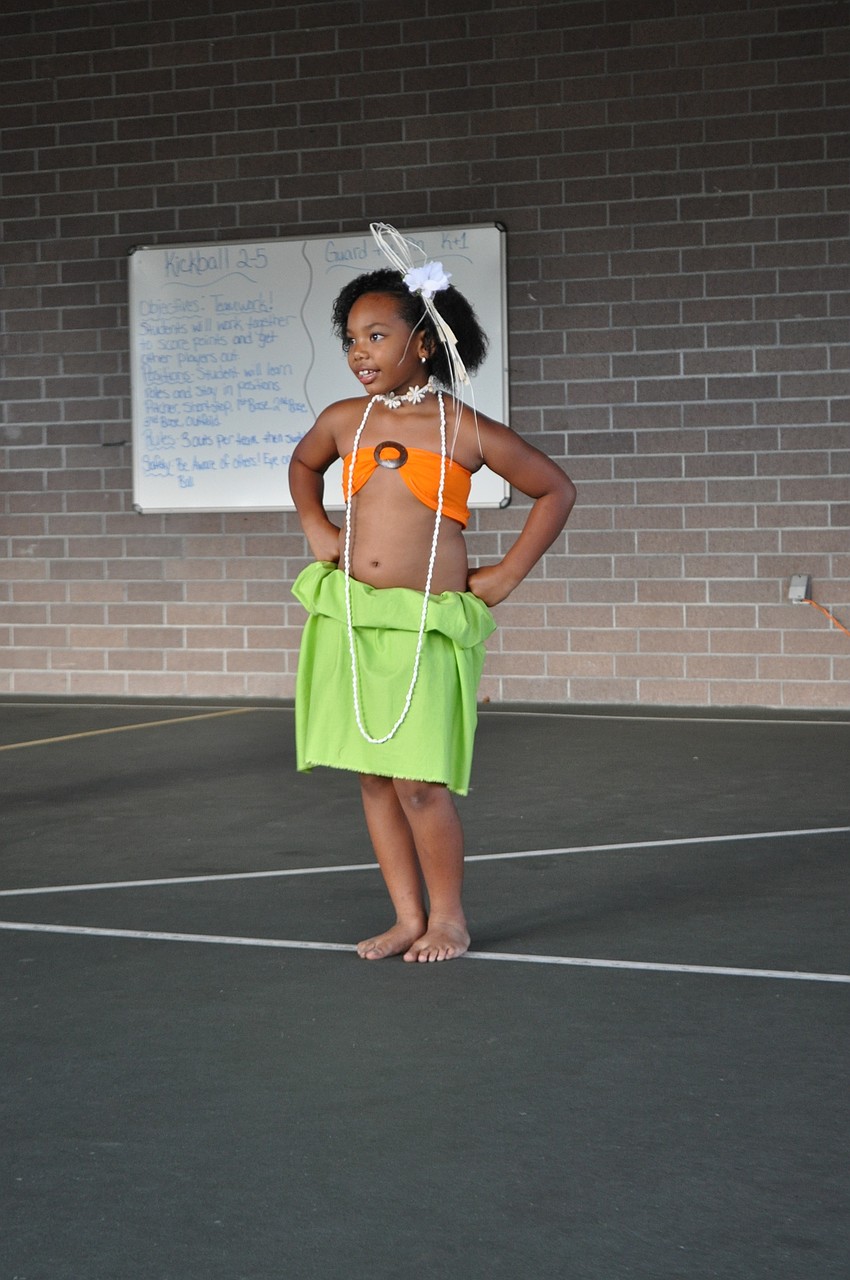 Lani Lino, 6, performs a Polynesian dance with dancers from Beautiful Sei of Polynesia.
