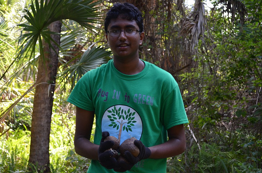 Vaisakh Nair with a handful of air potatoes