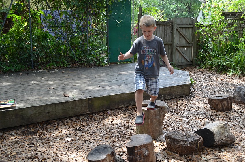 Rudy Shipley hops from log to log.
