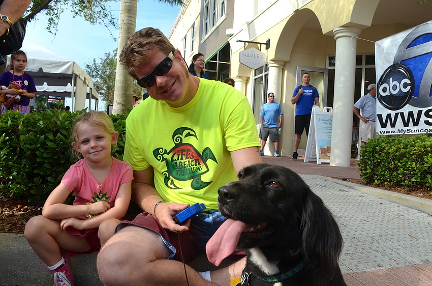 Sonny Hogue poses with her father, Julian, and her furry friend, Molly.