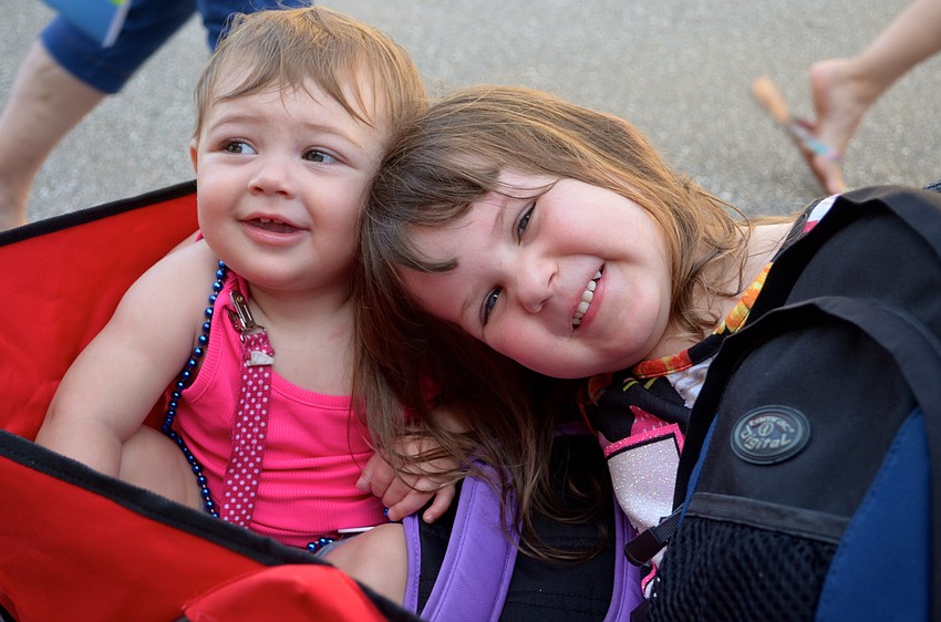 Bailey Merriman and Kiera Gunst relax inside a wagon.