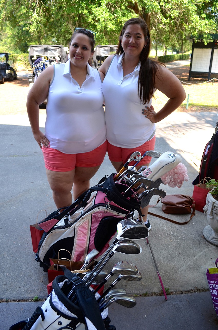 Jessica Sondey shows support for her father and her Alma Mater, alongside her friend, Brianna Harber.
