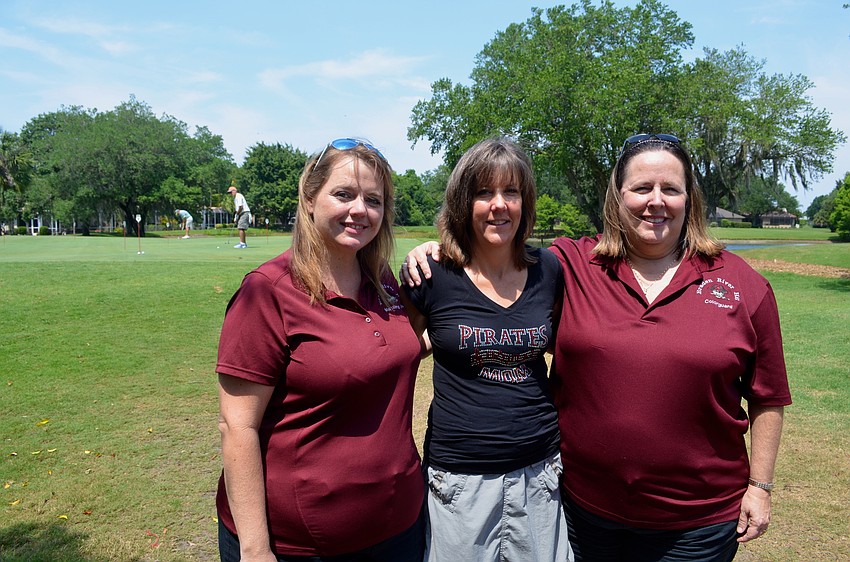 Event organizers Katie Williams, Donna Love and Kelly Beyerlein enjoy an afternoon on the golf course.