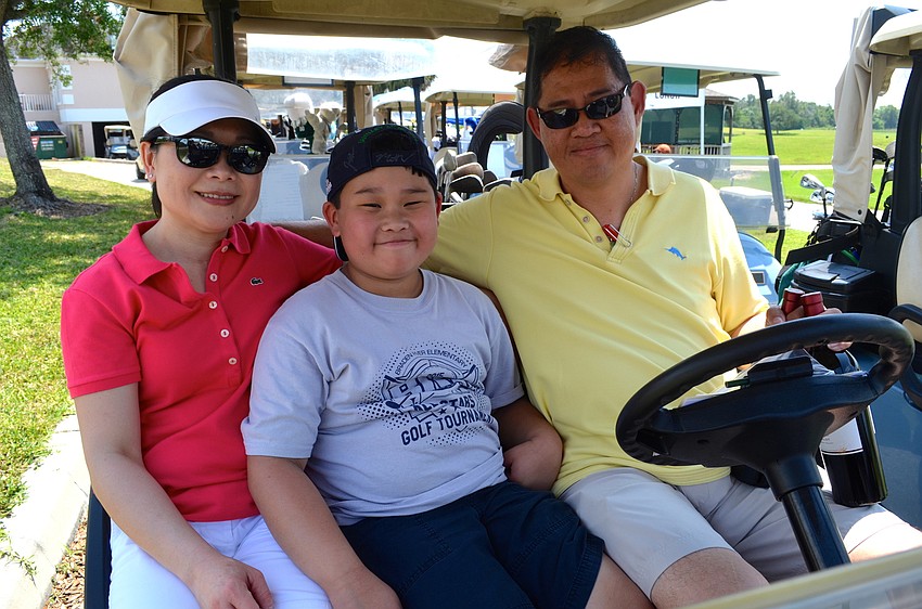 Phuong, Brendan and Robert Lam participate show support for the East County school.
