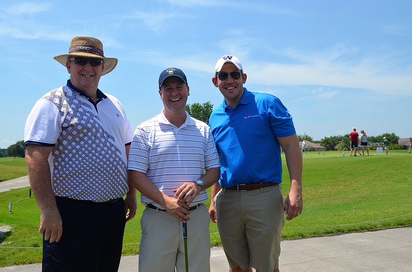 Dave McCulla, Andrew Lundin and Sean Keenan wait for the shotgun start at 1 p.m.