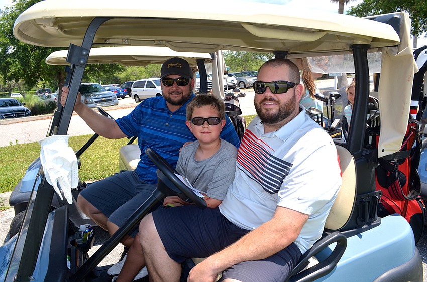 Justin Randolph tests out the vehicle for the event alongside Chase and Mike Polivchak.