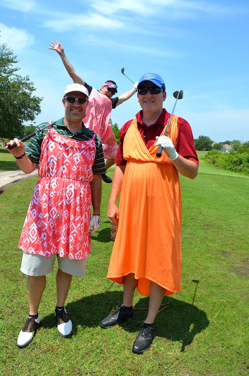 Gerry den Boggende photo bombs a photo of his friends, Sean Wood and Jim Chalmers.