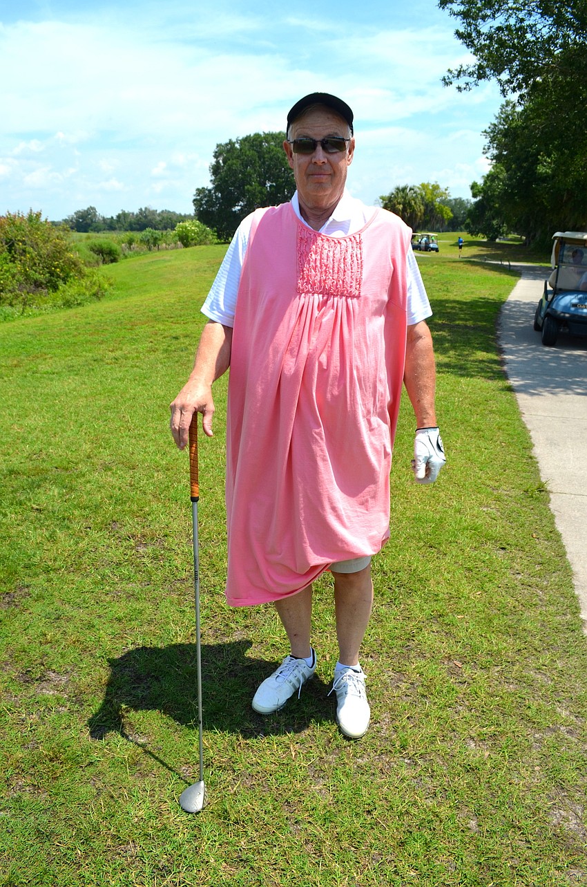 Richard Wood doesn’t let a dress district him from bringing his best golf game to the tournament.
