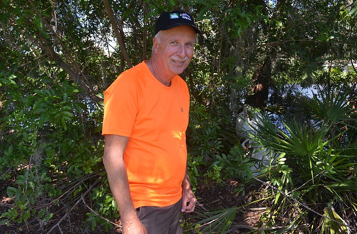 David Novak cares for 15 swans at Harbourside and Islandside, including two breeding pairs that are currently in nesting mode. Photo by Kristen Herhold