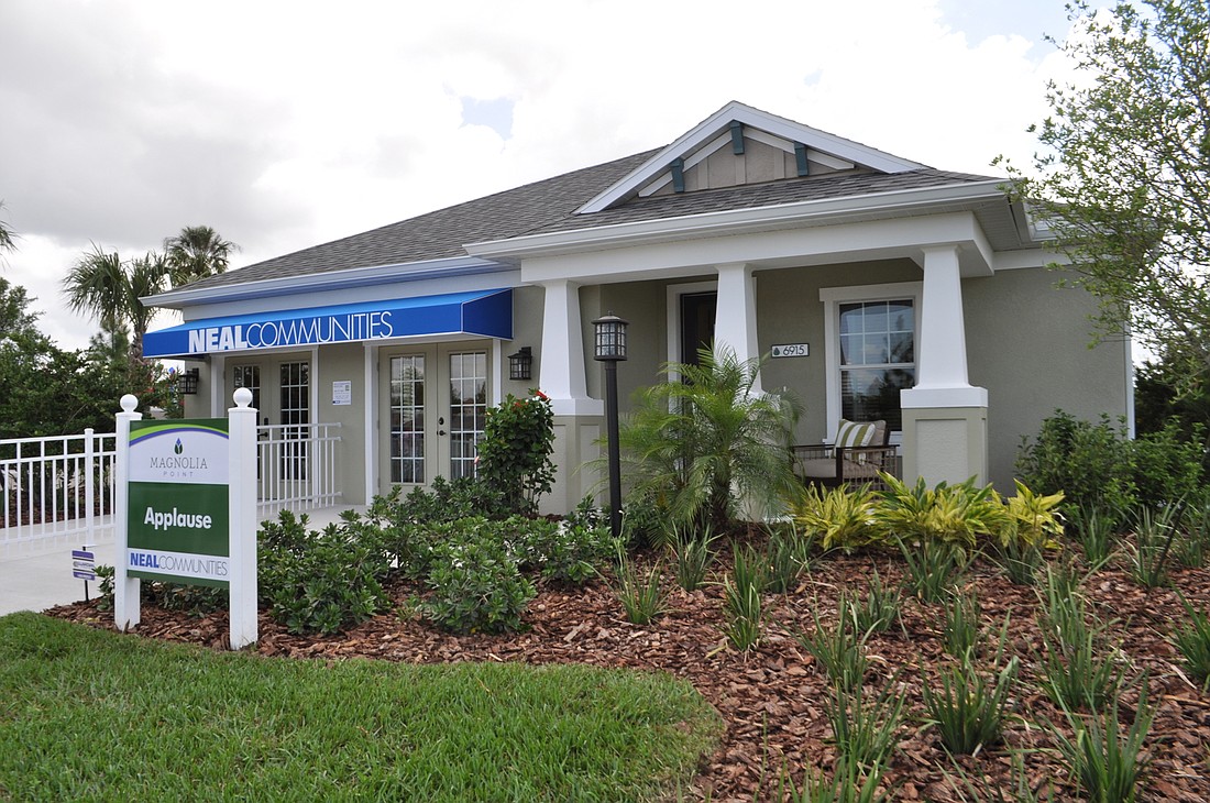 The one-level Applause model offers 2,110 square feet of living area, plus a two-car garage, lanai and entry for a total of 2,820 square feet. It has three bedrooms and two bathrooms. Photos by Pam Eubanks