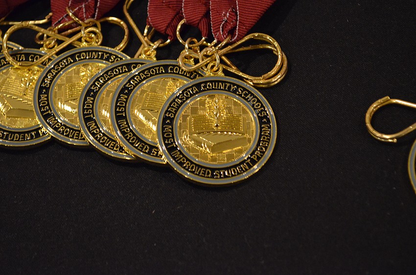 Students were given a medal with their school’s colors on the ribbon.