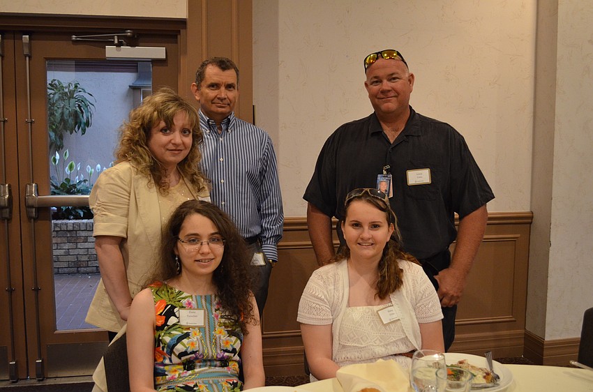 Students Elana Tsinober and Haley Coles with their parents Irene and Alan Tsinober and Lewis Coles.
