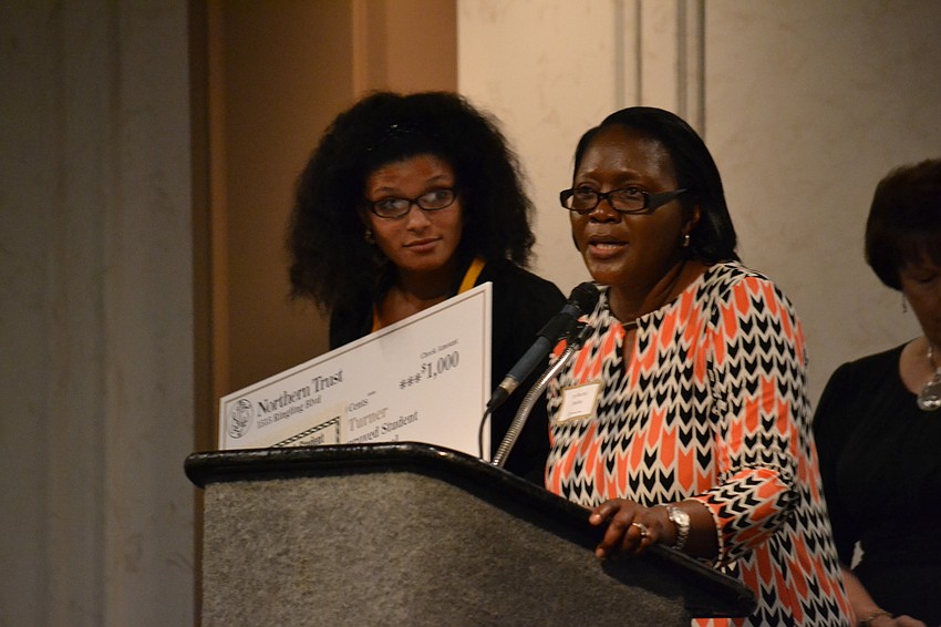 Booker High School principal Dr. Rachel Shelley congratulates student Nani Turner.