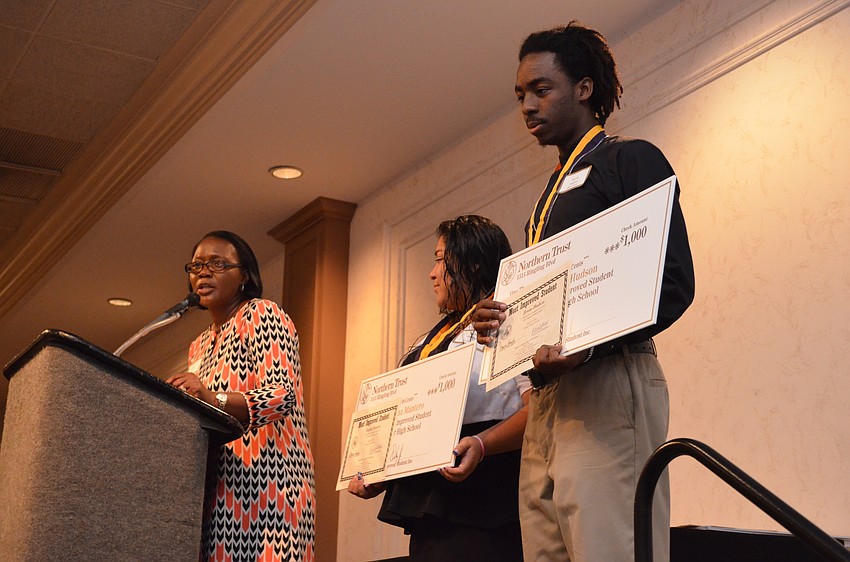 Students Regina Mantero and Brian Hudson receive their awards for Most Improved Students at Booker High School.