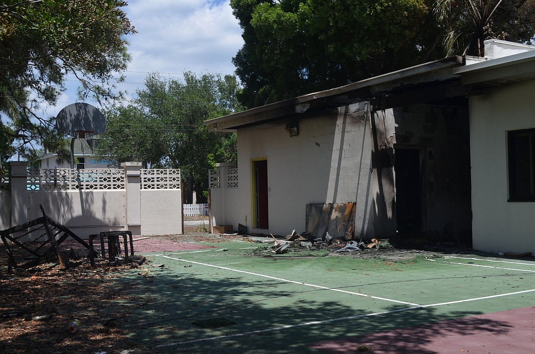 The State Fire Marshall is investigating two suspicious fires that engulfed part of the old YMCA building on School Avenue and a nearby shed Tuesday.