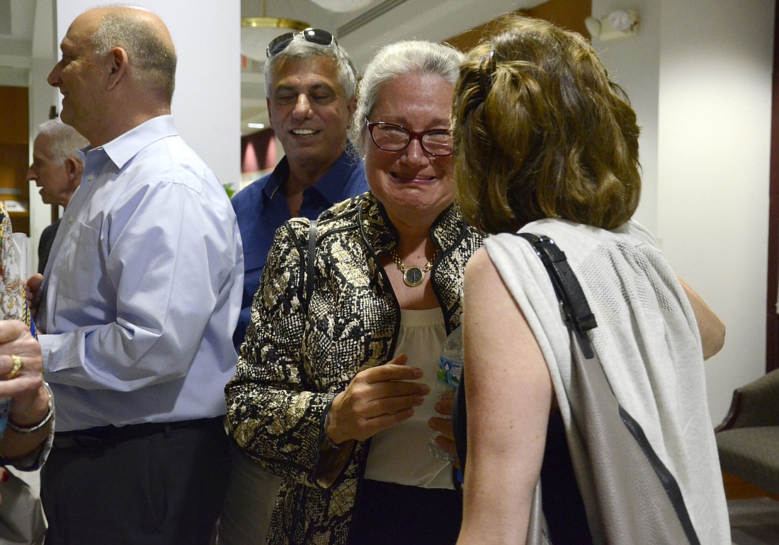 Nina Levitt embraces a neighbor after the Sarasota County Commissionâ€™s decision Tuesday. Photo by Jessica Salmond