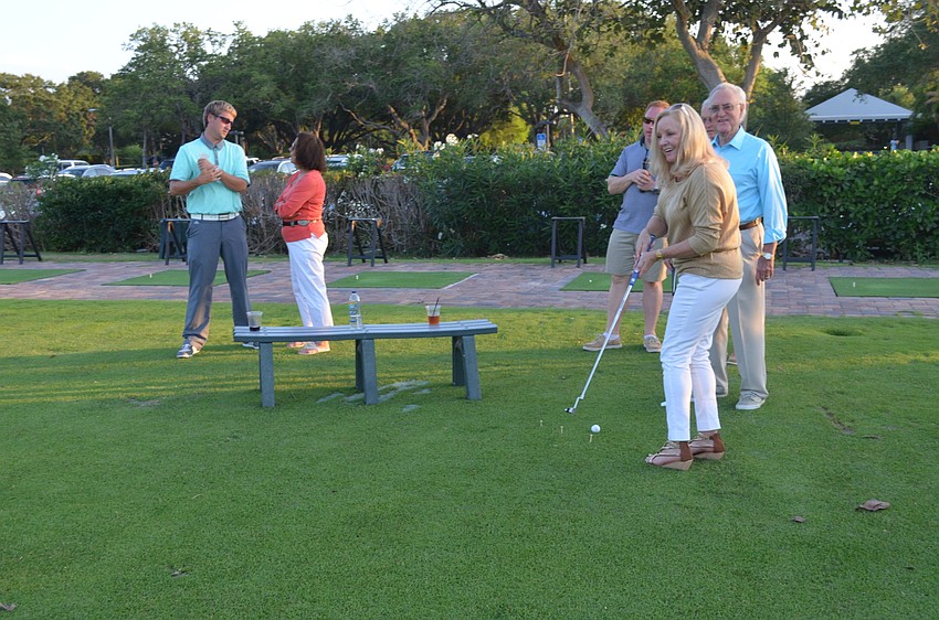 Phyllis Black participates in the putting competition.