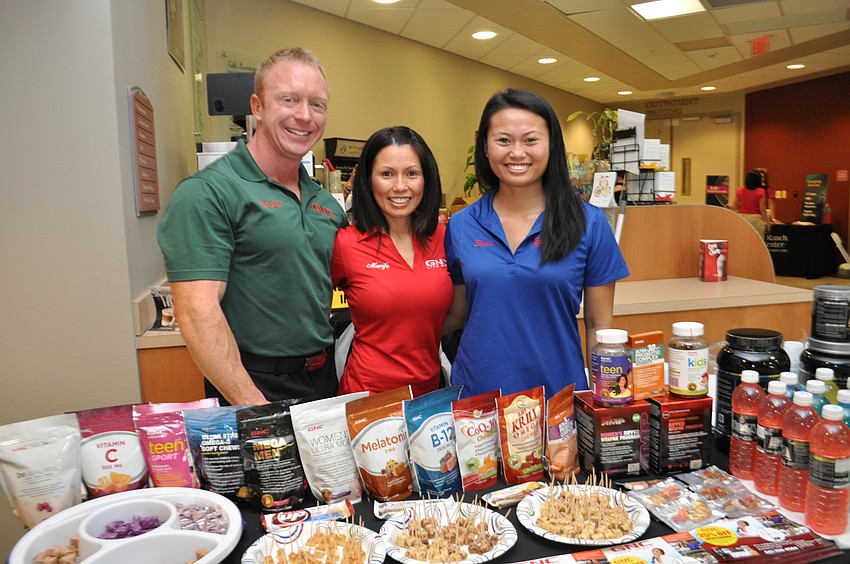 Randall and Marife Wagner and Sheva Delledonne pass out samples from Wagner Family GNC.