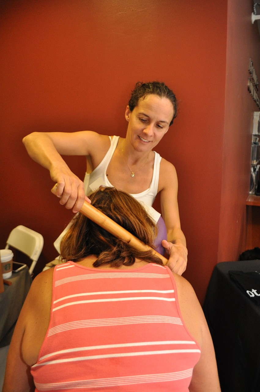 Nathalie Cecilia gives Cecilia Covais a bamboo fusion massage.