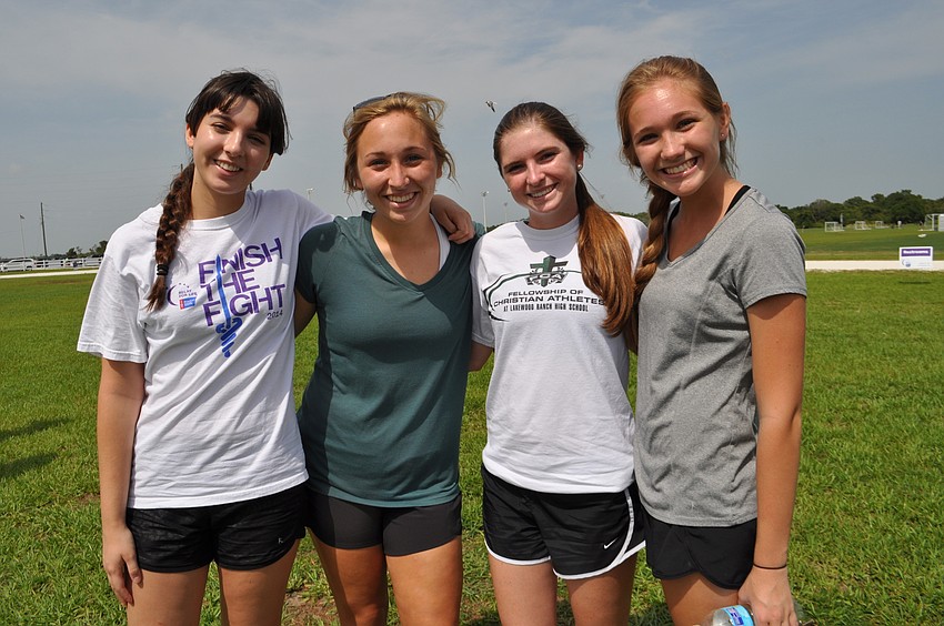 Lakewood Ranch High School’s Megan Manbeck, Kerstyn Kesgiropoulos, Katie Wray and Paige Venuto walk with Fellowship of Christian Athletes.