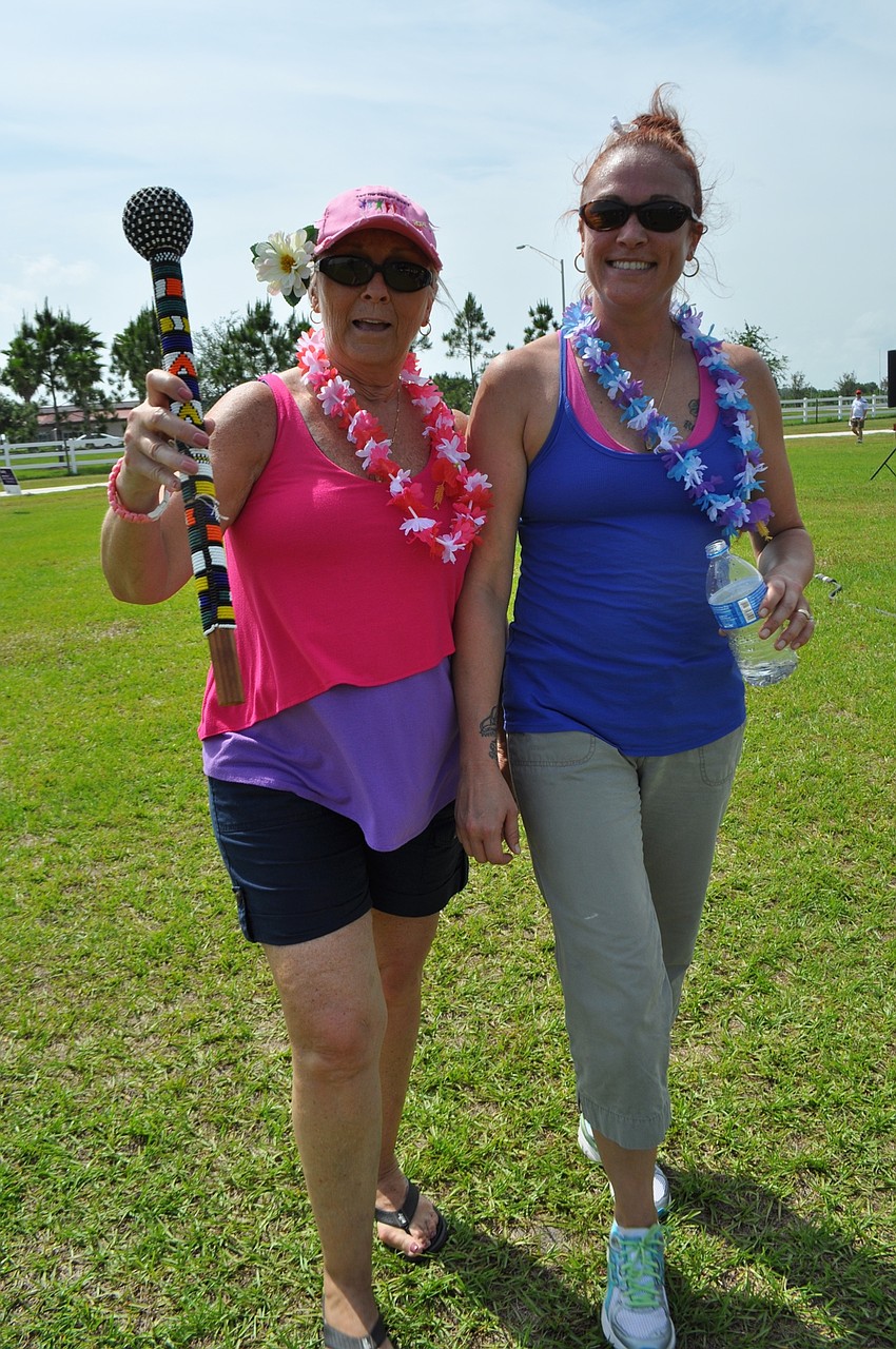 Laurie Macon and her daughter Leah Kelly walk with Crown Jewels.