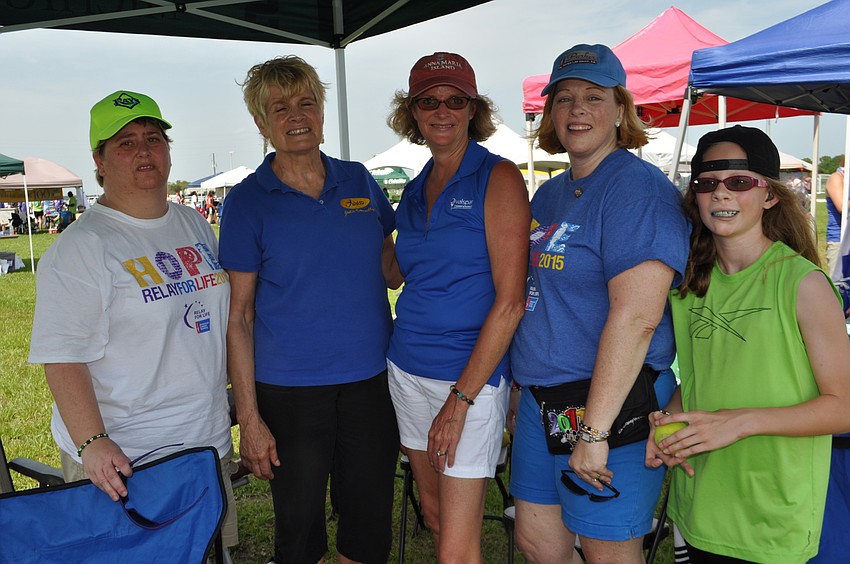 Beth Walch, Julie Donnelly, Bonnie Francis, Julie Parker and Marissa Parker walk with Parker’s Pirates of the Curribean.