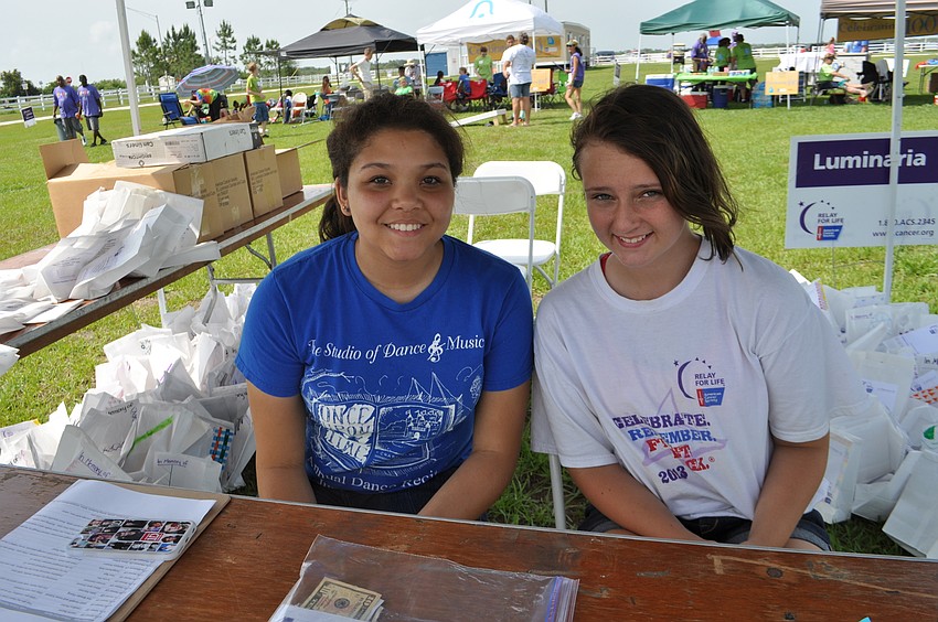 Alexa Brutus and Jade Simons sell luminaries.