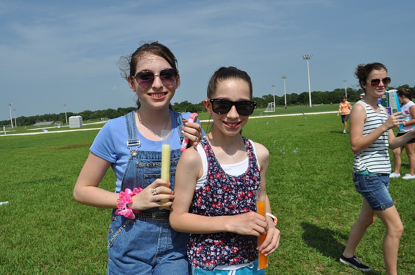 Diana Iznaola and Cameron Boudreau cool off with some popsicles.