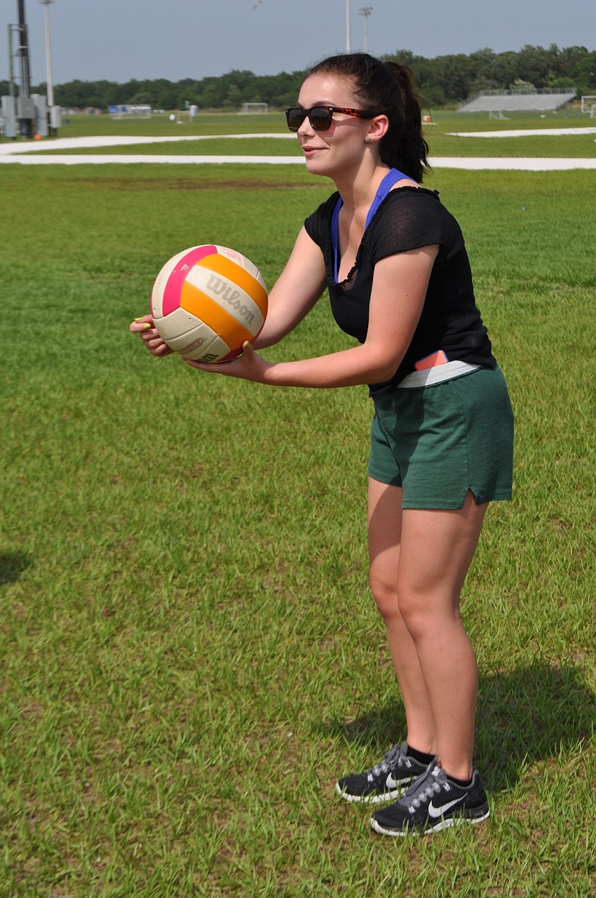 Julia Gennocro, of Braden River Middle School, plays volleyball between laps.