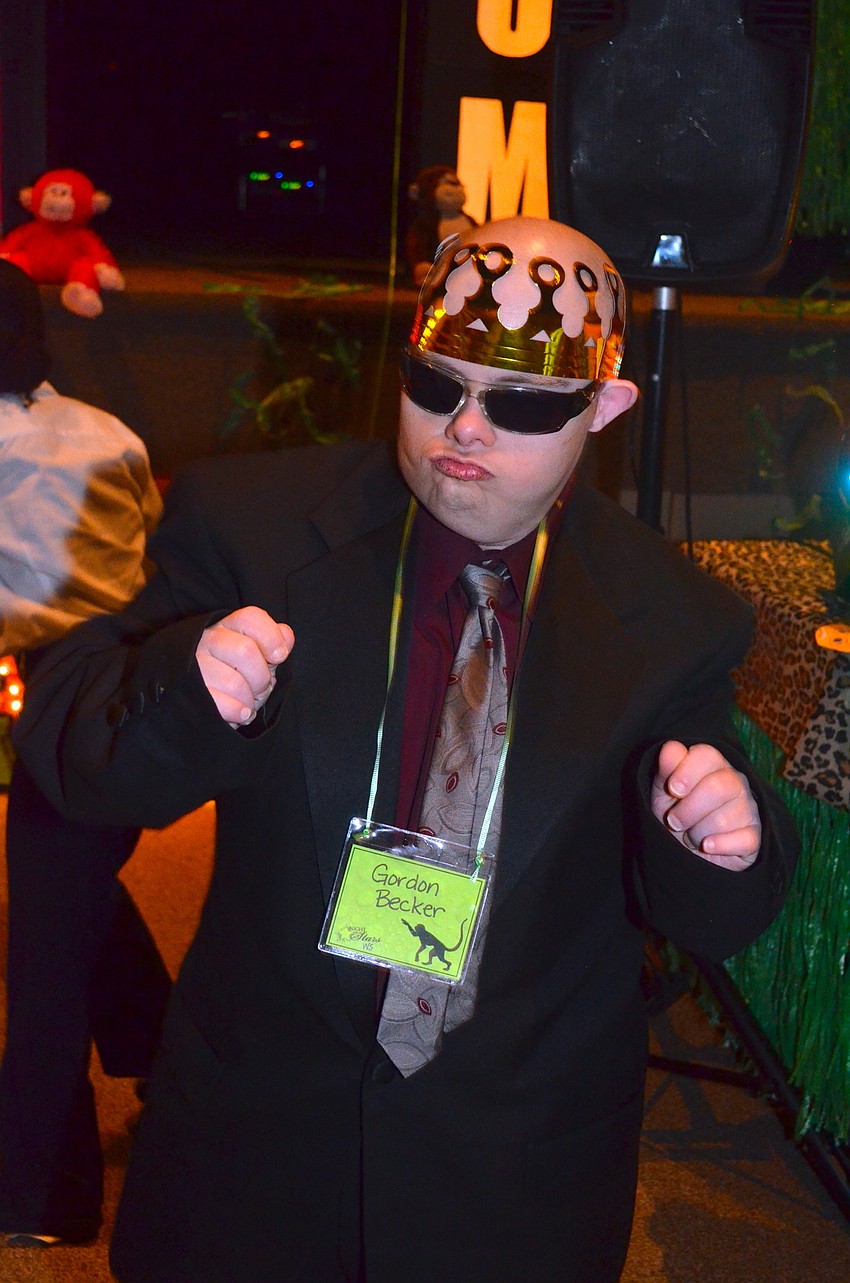 Gordon Becker sings along to a Pitbull song with dance moves equally as smooth.