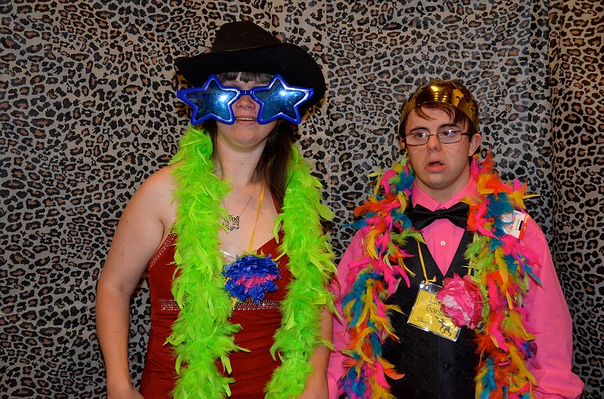 Eileen Bond and Luke Garsky act silly in front of the camera.