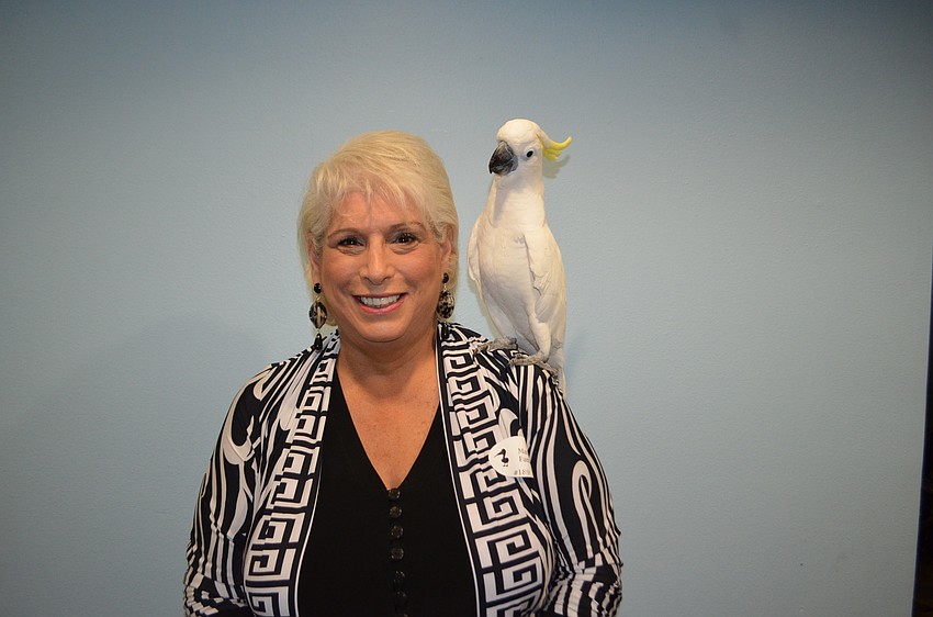 Marsha Panuce with Kelly, a cockatoo
